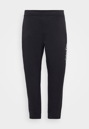 Calvin Klein SPLIT LINE LOGO - Tracksuit bottoms - black