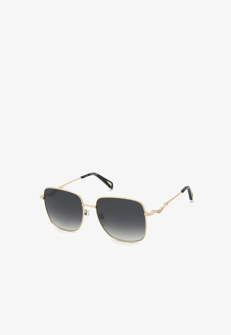 Lunettes de soleil de forme carrée avec verres dégradés noirs et fines montures métalliques dorées avec embouts de branches noirs.