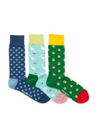 Tre paia di calzini di cotone: blu con pois bianchi, verde chiaro con conigli e uova, verde scuro con accenti gialli e motivi di pulcini.