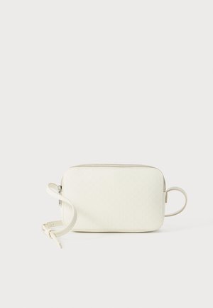 White geometric-patterned pouch with a zip closure, textured surface, attached wrist strap, and rounded corners. Compact and minimalist design.