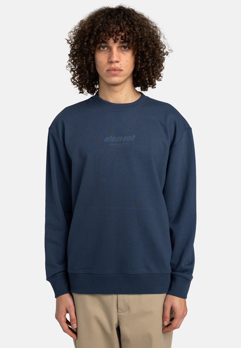 Navy blue sweatshirt with a crew neck, ribbed cuffs, and bottom hem. Features a subtle gray logo on the chest. Made from soft, textured fabric.