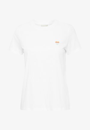 Valkoinen puuvillapaita, jossa on pieni, monivärinen sydänkuvio vasemmassa rinnassa. Lyhyet hihat ja klassinen pyöreä kaula-aukko.