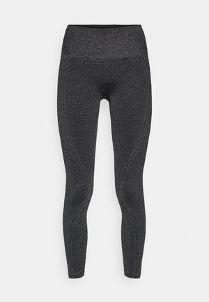 Black leggings featuring a shiny, textured surface, high waistband, and contoured seams for a fitted design. Suitable for active wear.