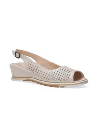 Beige Slingback-Wedge mit offener Zehenpartie, Ausschnittmuster, stabiler Ferse, verstellbarem Knöchelriemen und strukturiertem Inlay für Komfort.