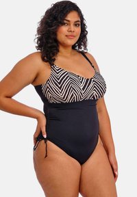 Maillot de bain une pièce noir avec un haut à imprimé zèbre, des bretelles réglables et des fronces sur les côtés pour un look ajusté.