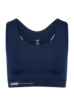 Granatowy stanik sportowy wykonany z gładkiego materiału. Posiada szerokie ramiączka, okrągły dekolt oraz srebrne logo "hummel PERFORMANCE".
