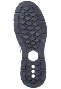 Semelle en caoutchouc noir présentant un motif en losanges pour l'adhérence, une pointe arrondie et des découpes hexagonales pour la flexibilité.