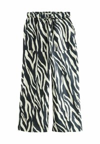 Pantalons à jambes larges avec un imprimé zèbre noir et blanc. Fabriqués en tissu léger, avec une taille élastique et un cordon de serrage. Deux poches latérales.
