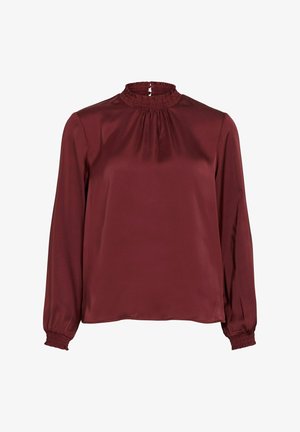 Blusa de manga larga color burdeos con alto cuello fruncido y detalles en los puños, hecha de una tela suave y brillante.