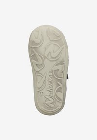 Sole of a small beige shoe with circular patterned tread, brand name "Naturino," and size number 20 visible.