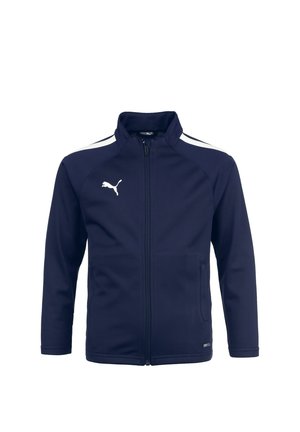 Marine blauwe ritsjas met hoge kraag, witte zijkanten, twee voorzakken en Puma-logo in het wit op de bovenste linkerkant. Glad stofoppervlak.