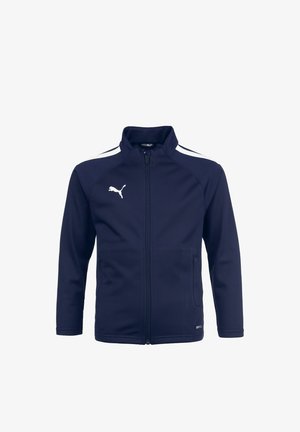 Marineblaues Zip-Jackett mit hohem Kragen, weißen Seitenstreifen, zwei Fronttaschen und Puma-Logo in Weiß oben links. Glattes Gewebe.
