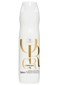 Witte shampoo fles met gouden accenten. De tekst bevat "Oil Reflections" en "Luminous reveal shampoo." Inhoud: 250 ml. Gladde textuur.