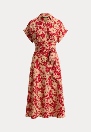 Rød blomstrete omslagskjole med korte ermer, belte og knelengde skjørt. Har en kremfarget bakgrunn med detaljerte blomsterutskrifter.