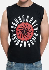 Black sleeveless t-shirt featuring a circular red graphic with black and white text, displaying the name "Soundgarden" and a triangular icon.
