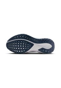 Suela de zapato en azul marino y blanco con un patrón texturizado de indentaciones hexagonales y circulares, diseñado para proporcionar agarre y flexibilidad.