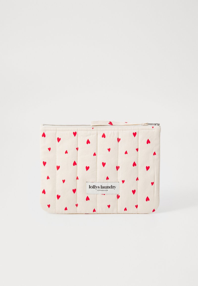Quilted beige pouch featuring a pattern of small red hearts, with a zip closure and a label reading "lollys laundry Copenhagen."