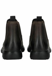 Botas de cuero marrón hasta el tobillo con paneles laterales elásticos, un diseño elegante y suelas de goma negras, que cuentan con una pestaña de tirón en la parte posterior.