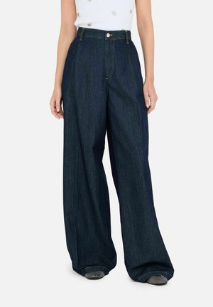 Dark blue wide-leg jeans made of denim, featuring a high waist, zipper fly, and contrast stitching. Front pockets visible.
