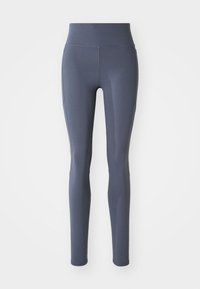 Højtaljede, tætsiddende leggings i mørkegrå materiale med en glat overflade, der har syede sømme og ingen synlige mønstre eller hardware.