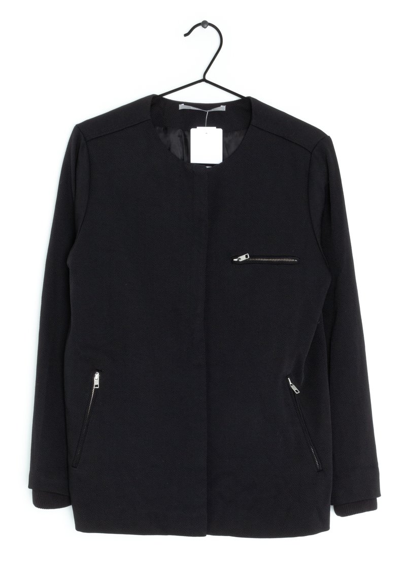 Black jacket with a round neckline, featuring a front zip pocket and two side zip pockets. Made from textured fabric with ribbed cuffs.