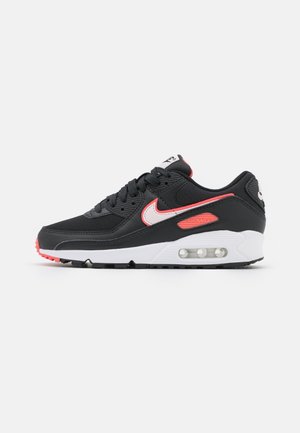 Black and pink Nike Air Max sneaker with white sole and visible air cushioning unit, shown in side profile on white background.