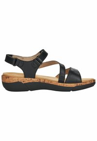 Sandalia de cuero negro con correas ajustables, plantilla de corcho y suela de goma texturizada. Diseño de punta abierta y detalles de costura sutiles.