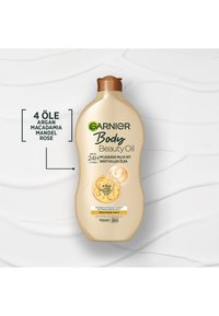 Garnier Body Beauty Oil flaske med 4 olier: argan, macadamia, mandel, rose, til 24-timers hydrering af tør hud, vegansk og hurtigt absorberende formel.