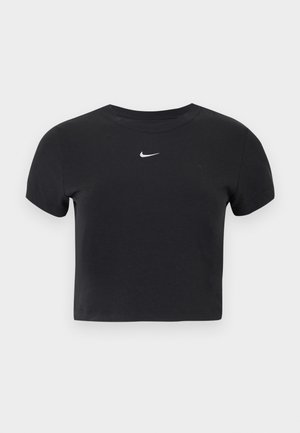 Camiseta negra recortada de algodón, con cuello redondo y mangas cortas. Destaca el logo blanco de Nike en el pecho.
