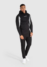 Smilodox MAISON - Træningsbukser - schwarz