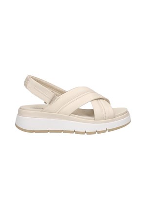 Beige polstret sandal med krydsede stropper, justerbar slingback og tyk hvid sål med struktureret beige ydersål.