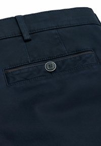 Navy blue trousers with a textured fabric, featuring a back pocket with a metal button closure and a loop above the waistband.
