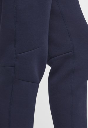 Nike Performance TECH - Tracksuit bottoms - obsidian guava ice