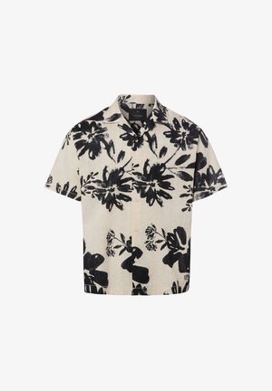 Chemise beige à manches courtes boutonnée avec un grand imprimé floral noir et un col classique.