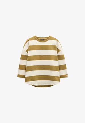 Koszula z długim rękawem w poziome paski w odcieniach ochry i kremu, okrągły dekolt, luźny krój, miękki materiał bawełniany, zakrzywiony dół, detal z logo na rękawie.