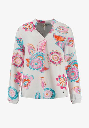 Blusa de manga larga en tejido ligero, con vibrantes patrones florales en rosa, turquesa y naranja sobre un fondo blanco.
