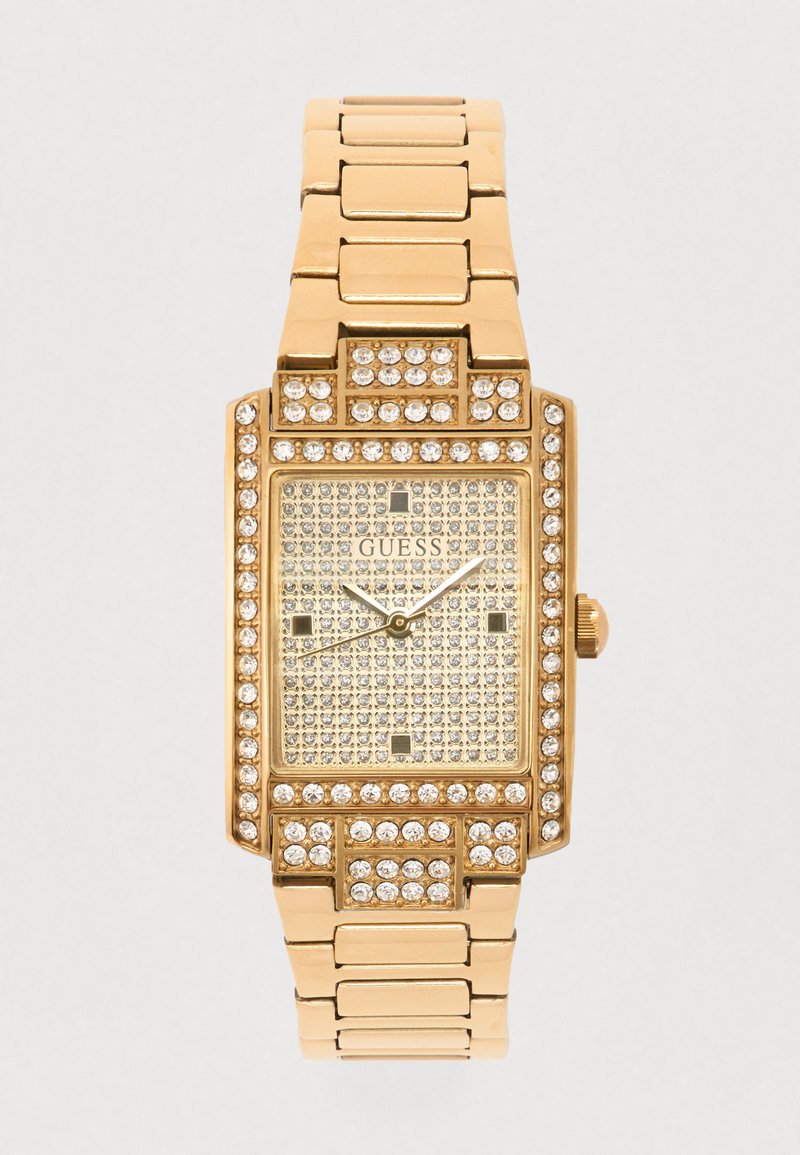 Orologio rettangolare in tono dorato con lunetta e bracciale tempestati di cristalli. Quadrante incrostato con piccoli indicatori e tre lancette metalliche.