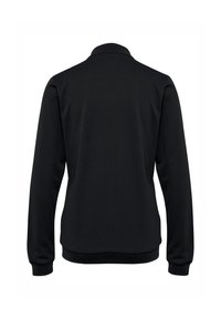 Schwarzes langärmliges Polohemd mit geripptem Kragen und Bündchen, glatter Textur und tailliertem Schnitt, das einen minimalistischen Stil präsentiert.