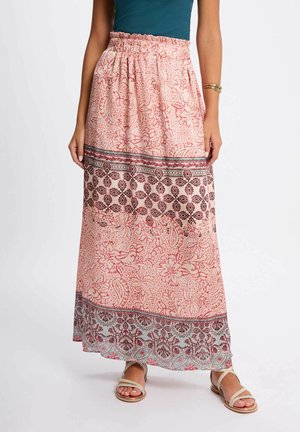 Gonna maxi in tessuto rosa con motivi floreali, dotata di una vita arricciata e di un bordo decorativo in pizzo all'orlo. Accenti in rosso e blu.
