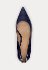 Navy blue, patent leather flat shoe with a pointed toe, croc-embossed texture, and cut-out sides; features a small gold accent.