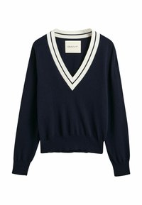 Maglione a V blu navy realizzato in tessuto morbido, con bordi bianchi e polsini a costine. Fit slim con un design leggermente accorciato all'orlo.