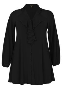 Sort bluse med lange ærmer og volang foran. Har design med knaplukning og blød stoftekstur. Let udvidet form.