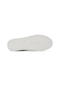 Semelle en caoutchouc blanc d'une basket TOMS avec un motif de semelle en chevron et le logo TOMS embossé au centre.