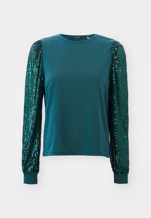 Camisola de manga longa em teal com corpo ajustado e mangas volumosas cobertas de lantejoulas. Material de algodão com punhos canelados e gola redonda. Aplicações texturizadas.