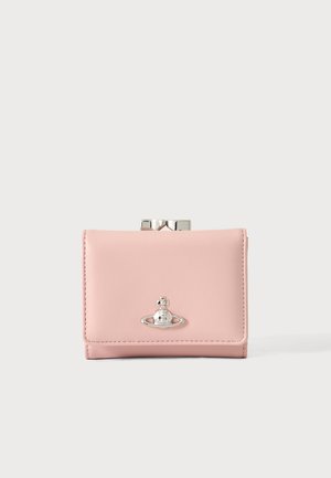 Small pink leather wallet with silver clasp and metallic orb logo on front, set against a plain light background.