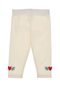 Cremefarbene Leggings mit roter Herz- und grüner Blatteinstickung nahe den Säumen, mit elastischem Bund für zusätzlichen Komfort.