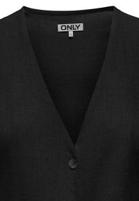 Black sleeveless vest with a V-neck design, made of textured fabric, featuring a single button closure and a simple label at the neckline.