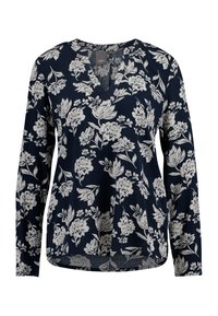 Námořnická blůza s květinovým vzorem v bílé barvě. Má výstřih do V a dlouhé rukávy, zaoblený spodní lem a jemnou texturu látky.