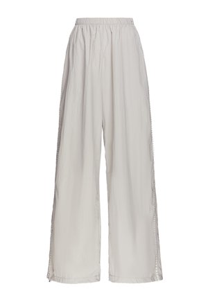 Light beige wide-leg pants with elastic waistband and subtle decorative trim running down the outer side seams, displayed on a white background.