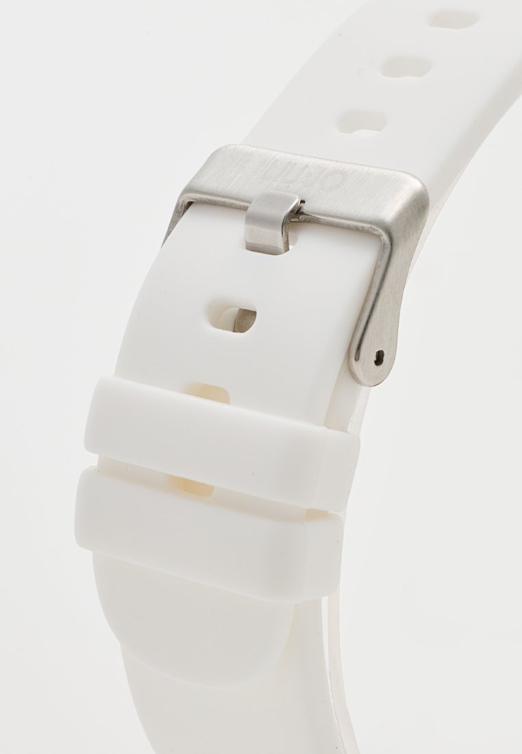 Cinturino per orologio in silicone bianco con molteplici fori per la regolazione, dotato di una fibbia in acciaio inossidabile silver e una texture liscia e opaca.